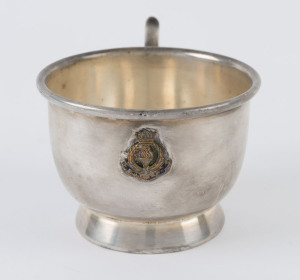 HMS Renown silver plated cup bearing the ship's crest, stamped 'SMPC' (Sydney) on base, height 7cm, weight 240gr.