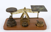 Set of scales and assorted brass weights, early 20th century, ​the base 21.5cm wide