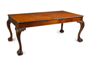 A Chippendale revival dining setting finely carved in mahogany and hardwood, comprising a table four