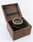 Negretti and Zambra bearing compass in cedar box with brass fittings,stamped "Negretti & Zambra, London, C.M.O. 20",the box 18cm high, 23.5cm wide, 21.5cm deep.