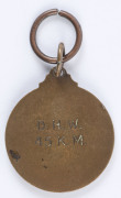 THE LONDON to MELBOURNE, MacROBERTSON CENTENARY AIR RACE 1934 Bronze fob created to honour the winning entry, the "Uiver", 25mm diameter and depicting the aeroplane, a KLM Douglas DC2 in flight over a map depicting the route (obverse); the reverse with "D - 2