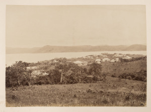 THURSDAY ISLAND & FAR NORTH QUEENSLAND: Large format album with red leather spine and corners, gilt titles "THURSDAY ISLAND", circa 1985; with approximately 40 albumen print photographs affixed back-to-back to the thick card pages; several titled in the p