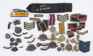 Selection with 1939-1945 KGVI War Medal and Defence Medal, WWI Royal Engineers cap badge, Australian Commonwealth Military Forces cap badges (3), Royal Artillery Cap Badge, East Lancashire Regiment 'EGYPT' campaign cap badge; also sew-on badges & stripes,