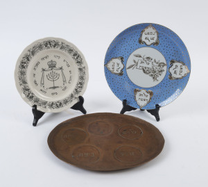 [JUDAICA]. A group of Passover seder plates comprising a blue & white ceramic platter with gilt lettering by "Westminster Fine China - Australia"; a ceramic platter titled "Passover" by Grindley's England; and a homemade beaten copper oval shaped platter,