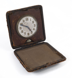 [JUDAICA] Omega 8-Day travel clock in leather folding case; the back of the clock endorsed "Presented to Mrs F.T. Crawcour by the President, Committee of the Hebrew Ladies Benevolent Society & Montefiore Home : as a token of affection & esteem in recognit