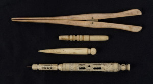 Whalebone glove stretcher, bodkin, needle case and Stanhope (missing lens), 19th century, (4 items), ​the glove stretcher16cm long