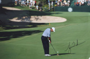 TIGER WOODS: Large glossy colour photograph of Woods chipping to the green (30.5 x 40.5cm), SIGNED BY WOODS in lower right corner, with Sports Legends Ltd CofA (2011).