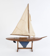 A vintage pond yacht on stand, red pine and steel, circa 1920s, ​56cm high overall