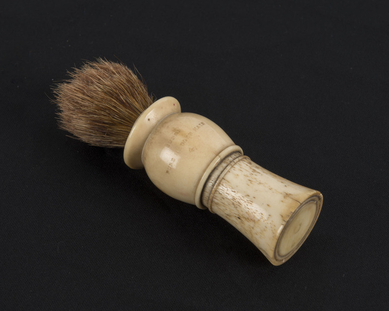 A Georgian shaving brush, whalebone and bristle, early 19th century, ​10cm high