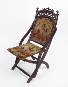 MONTROSE COTTAGE BALLARAT. An antique English folding chair with original floral upholstery, 19th century, 45cm across the arms. PROVENANCE: Eureka Museum, Montrose Cottage, Ballarat