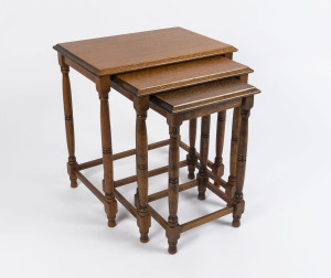 A nest of three occasional tables, silky oak, Queensland origin, early 20th century, the largest 56cm high, 52cm wide, 36cm deep