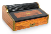 An Anglo-Indian campaign writing slope, ebony, camphor and walnut with brass mounts, tambour roll-top with embossed leather interior with hidden compartments, mid 19th century, 22cm high, 49cm wide, 38cm deep