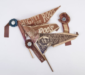 NORTH MELBOURNE: Late 1970s era pennants (3), one a premiership year pennant "Nth Melbourne For Ever" with image of captain Keith Greig (who missed most of the 1977 season & the GF due to injury) and names of team members incl. Blight, Glendinning, Schimmelbusch, Keenan & Alves, another "Mighty Roos for the Premiership" with rosette and badge attached; also two supporter rosettes (with badges) from the same era. (5 items)