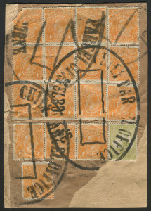 AUSTRALIA: Postal History: c.1920 parcel wrapper fragment franked with KGV 4d orange (16, some defective) including block of 6 and two strips of 3, plus a 3d Roo, tied by four strikes (one complete) of the huge undated 'CHIEF PARCEL OFFICE/MELBOURNE' handstamp.