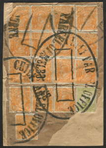 AUSTRALIA: Postal History: c.1920 parcel wrapper fragment franked with KGV 4d orange (16, some defective) including block of 6 and two strips of 3, plus a 3d Roo, tied by four strikes (one complete) of the huge undated 'CHIEF PARCEL OFFICE/MELBOURNE' han