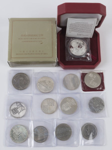 Coins - World: Israel: 1950s-80s 35mm silver State Medals with 935/1000 purity (12) including 1958 "Peace be Within thy Walls", 1962 "Israel Liberated", 1974 Chaim Weizmann, 1979 "Terra Sancta" & 1982 Temple Mount, individual weights between 22 and 30gr, total weight 320gr; also Hong Kong 1997 "Return to China" pure silver commemorative coin (40gr) in original box. (13 items)