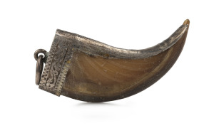 An Indian tiger claw pendant set in silver, 19th century, 4cm high