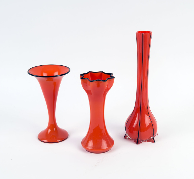 Three red and black Bohemian "Tango" glass vases, circa 1920s, the largest 30cm high