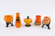 Five assorted Bohemian orange glass vases including a "Tango" silhouette vase, circa 1920's the silhouette vase 16.5cm high