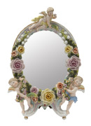 A Sitzendorf German porcelain floral framed mirror, 19th century, 31cm high