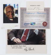 RICHARD NIXON pen signature on name card (with Chaucer Covers CofA); GEORGE BUSH felt-tip signature on piece; DESMOND TUTU signed and dated (faded) below a photograph, "God bless you, Desmond Tutu, Dec. 2006". (3 items).