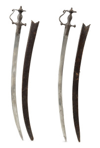 A pair of Indian Talwar swords in original leather scabbards, 91cm long