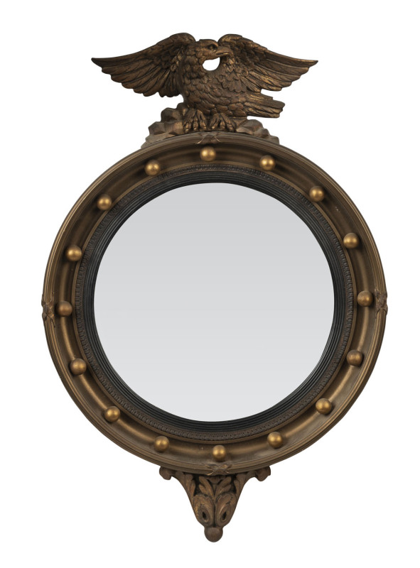 A convex circular gilt framed mirror with eagle crest, 19th century, ​65 x 43cm