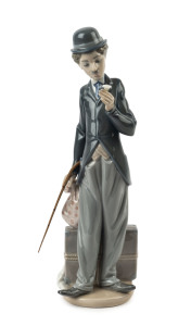 LLADRO "Charlie Chaplin, The Tramp" porcelain statue, 20th century, with original walking cane, blue factory mark to base, 28.5cm high
