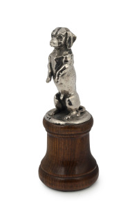 A begging dog car mascot, chromed cast metal on later turned wooden plinth, circa 1930s, 19cm high overall