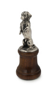 A begging dog car mascot, chromed cast metal on later turned wooden plinth, circa 1930s, 19cm high overall