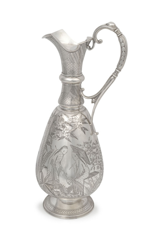 A stunning Aesthetic Movement English sterling silver claret jug in the Japanese style, by Richards & Brown of London, circa 1879, and retailed by "Flavelle Bros. & Roberts, Sydney & Brisbane", with later inscription "General Manager's Trophy Burroughs Lt