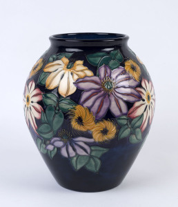 MOORCROFT floral patterned English pottery vase, late 20th century, impressed "Moorcroft, Made In England" signed "W.M. 148/400, © 97", 27cm high, 24cm wide