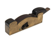 An antique infill plane, brass and rosewood with Ward blade, 19th century, 3.5 x 20cm sole, 26cm long overall