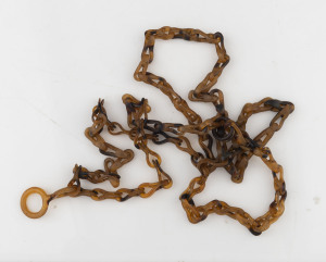 An antique tortoiseshell necklace, 19th century, ​104cm long