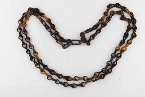 A double strand antique tortoiseshell necklace, 19th century, ​70cm long