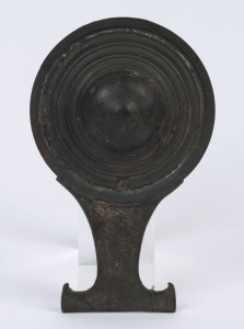 An archaic style Chinese bronze mirror, 19.5cm high