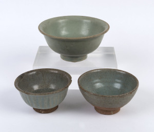 Three Thai celadon ceramic bowls, 17th/18th century, the largest 7cm high, 14.5cm diameter