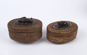 Two Indonesian woven baskets with carved wooden animal finials, early 20th century, the larger 12cm high, 17cm wide