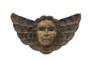 A cherub wall plaque, carved wood with polychrome finish, 18th/19th century, 31cm wide