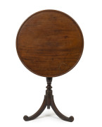 A Georgian mahogany wine table with tilting top, late 18th early 19th century, ​69cm high, 64cm diameter