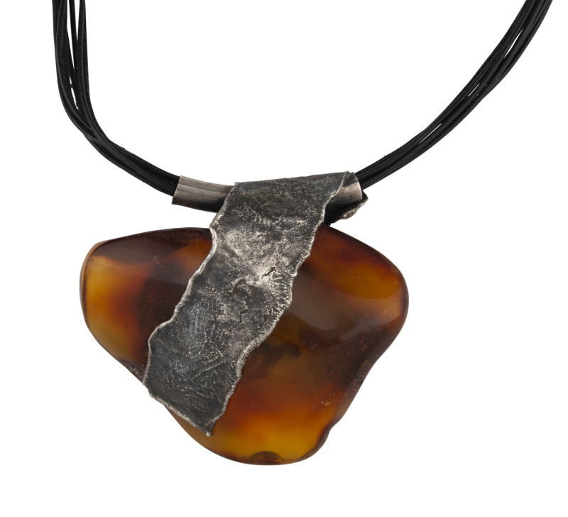 A vintage sterling silver and large amber mineral specimen pendant on black leather necklace, circa 1970, stamped "925" with pictorial maker's marks, ​the pendant 8.5cm wide