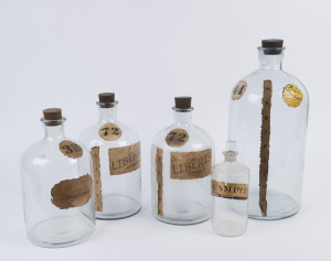 Five assorted antique pharmacy bottles, 19th century, the largest 48cm high