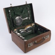 A sterling silver antique travel set in original leather case, retailed through W.E. JACKSON "The Bag Store" Nottingham, circa 1907, ​the case 43cm wide