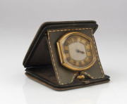 An antique travel clock, early 20th century, ​9cm high