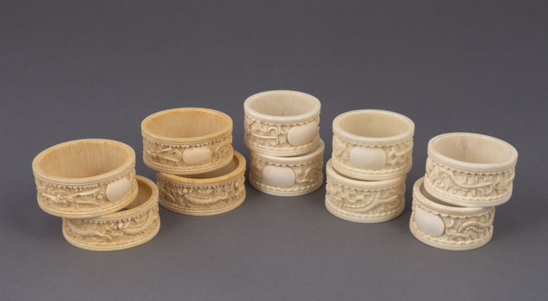 A set of six Chinese carved ivory napkin rings together with a set of four similar examples, early 20th century, (10 items), 4.5cm and 5cm diameter