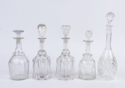 Five assorted antique crystal and glass decanters, ​the largest 38.5cm high