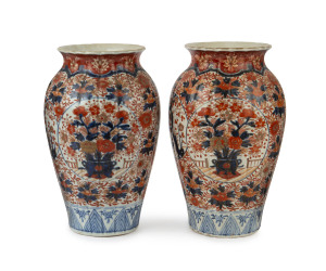 A pair of Japanese Imari mantel vases, early Meiji period, 19th century, 33cm high