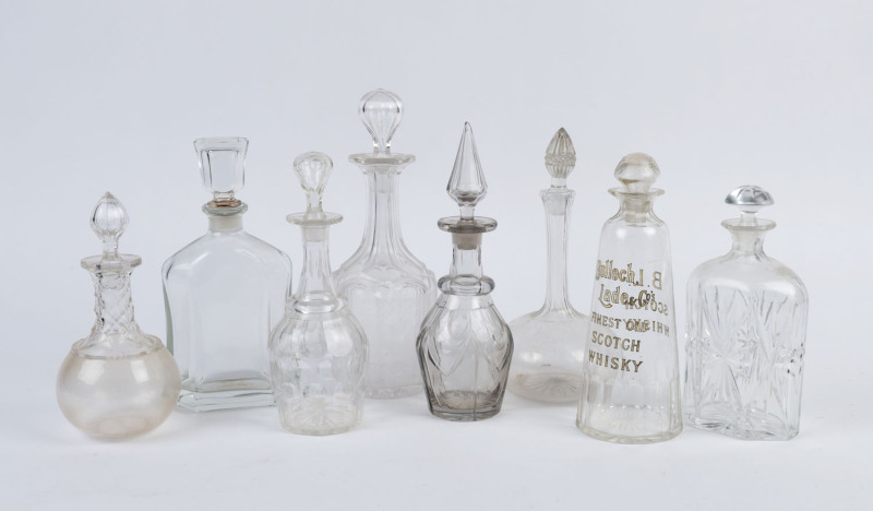 Eight assorted glass and crystal decanters including "BULLOCH, LADE & Co." whisky advertising example, 19th and 20th century, ​the largest 32cm high