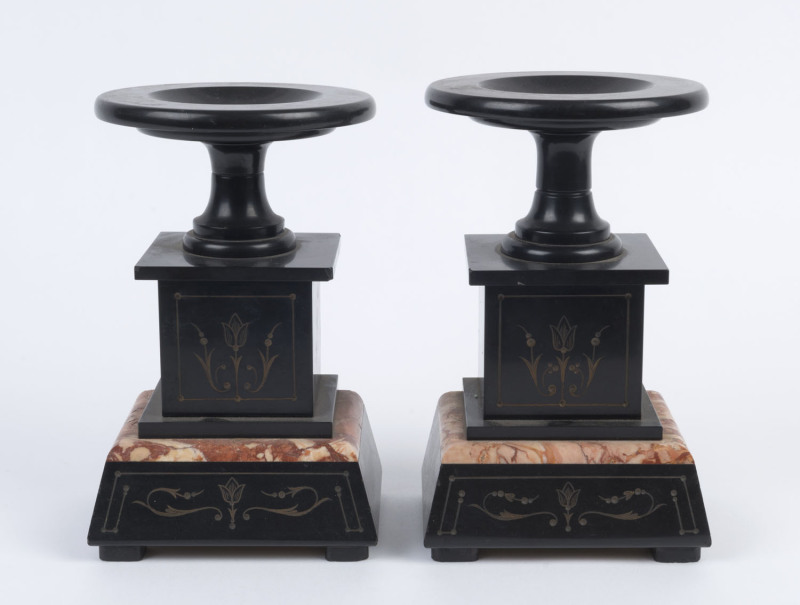 A pair of rouge marble and black slate clock garnitures, 19th century, ​23cm high