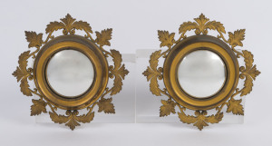 A small pair of French convex mirrors in gilt metal frames, 19th century, 18cm diameter